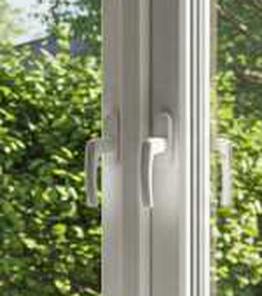 Two-sash PVC casement window with center mullion — close-up of the details