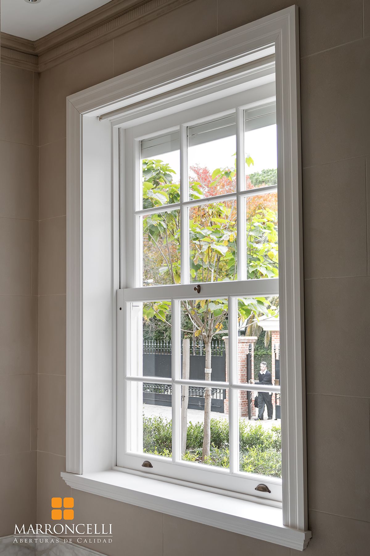 Six-over-six sash window with stepped casing